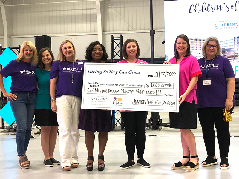 Celebrating the Junior League of Jackson’s $1 million gift to the Campaign for Children’s of Mississippi are, from left, Meredith Aldridge, 2018-2019 JLJ president and director of development for Children’s of Mississippi; Keri Henley, UMMC associate executive director of development; Melanie Hataway, 2016-2017 JLJ president; 2019-2020 JLJ president LaKeysha Greer Isaac; Dr. Barbara Saunders, JLJ member and division chief for Child Development at UMMC’s Center for Advancement of Youth; Natalie Hutto, executive director of the Department of Pediatrics at UMMC; and Heidi Noel, 2017-2018 JLJ president. 